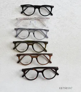 Detailed view of vintage round titanium eyeglass frames in multiple classic colors.