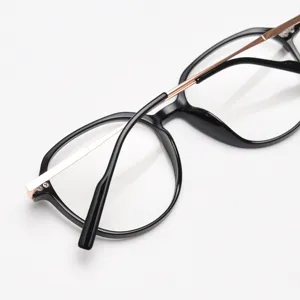 Detailed view of black TR90 optical glasses frame with sleek rose gold metal temples.