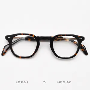 Detailed view of vintage tortoise shell acetate optical glasses frame with titanium temples.