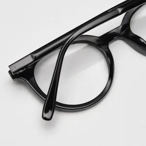 Close-up detail of black acetate optical glasses frame, retro round style for daily wear.