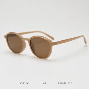 Detail view of stylish retro TR90 polarized sunglasses in light beige, trendy daily eyewear.