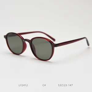 Detail shot of retro round TR90 polarized sunglasses in dark red, stylish eyewear for daily wear.