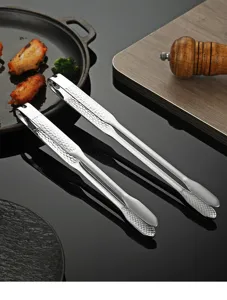 Stainless steel kitchen food tongs detail view, perfect for barbecue, steak, and cooking use.