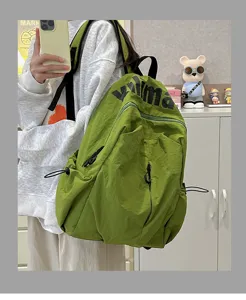 Casual olive green nylon backpack with drawstring and front zipper for school travel.