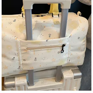 Large capacity travel duffel bag with trolley sleeve and cute star pattern for women.