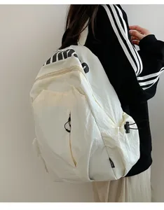 Casual lightweight waterproof backpack, large capacity school bag for daily outdoor travel.