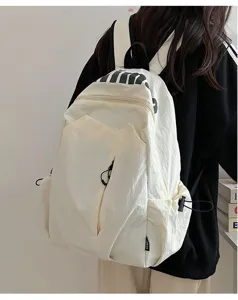 Casual minimalist large capacity waterproof campus backpack for daily travel and outdoor use.