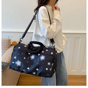 Detailed view of the stylish large capacity travel duffel bag with star print and handles.