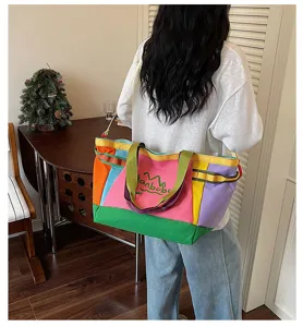 Color-block canvas tote bag, large capacity travel and commuter shoulder bag details.