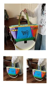 Detail shot showing the colorful canvas tote bag handles and multi-color patchwork design.