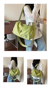 Sac bandoulière en toile verte vue de détail avec poches zippées et sangle.
