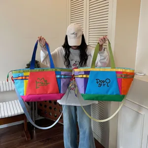 Detailed view of large capacity color-blocked shoulder tote bag, ideal for daily commute.
