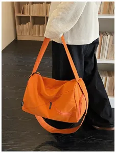 Sac de voyage sport orange detail, grand sac de sport pour femmes utilisation quotidienne.