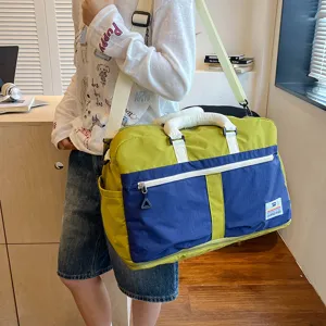 Colorblocked travel duffel bag large capacity sports gym bag with adjustable shoulder strap.