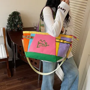 Korean style large capacity color block canvas shoulder tote bag for travel and daily commute.