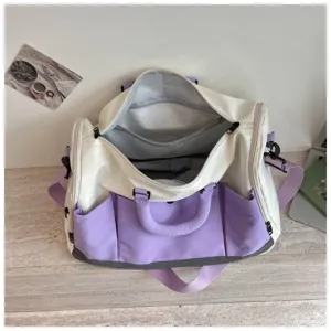 Detailed top view of large white and purple duffel travel bag interior compartments