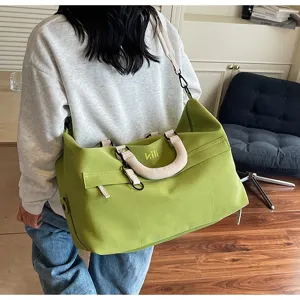 Large capacity travel duffel bag for women and men, casual canvas waterproof sports gym bag.