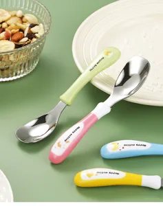 Stainless steel baby spoon detail view, cute cartoon handle design, safe feeding tableware.