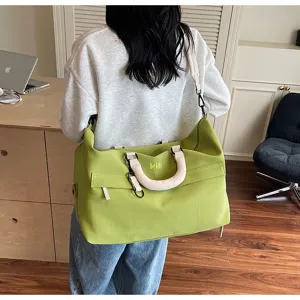 Large capacity travel duffel bag for women and men, lightweight green gym shoulder bag.