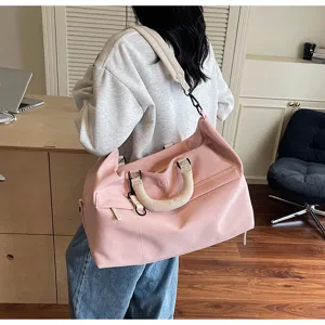 Large capacity pink travel duffel bag for women, portable shoulder crossbody fitness gym bag.