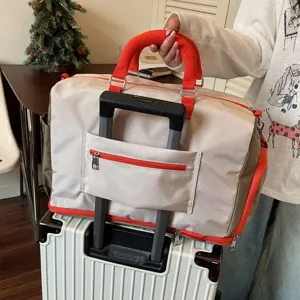 Large capacity travel duffel bag with luggage sleeve, lightweight weekender bag for men and women.