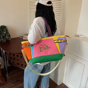 Colorful canvas travel tote bag, large capacity casual shoulder bag for outdoor commuting.