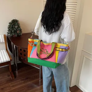 Spacious color-block canvas tote bag for casual travel, daily commuting, and stylish moms.