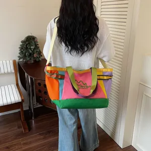 Large capacity color-block canvas tote bag, casual shoulder travel bag for daily commute.