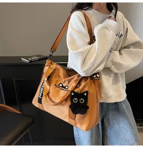 Grand sac de voyage fourre-tout pour femme, sac bandoulière décontracté avec pendentif chat.