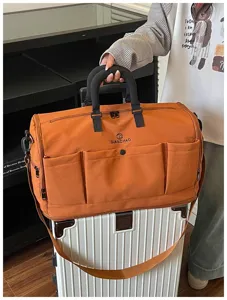 Large capacity travel duffel bag for short trips, portable gym and sports luggage storage bag.