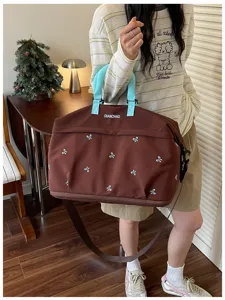 Grote capaciteit reistas duffle bag met schattige strikjes en schouderband voor reizen.