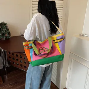 Color-block canvas tote bag for women, large capacity shoulder bag for travel and daily commute.