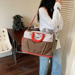 Large capacity travel duffel bag for women and men, lightweight gym sports bag with shoulder strap.