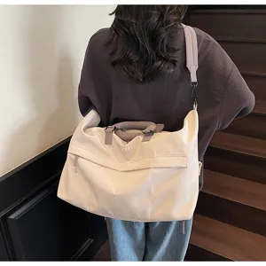 Large capacity travel duffel bag for women and men, lightweight casual canvas shoulder bag.
