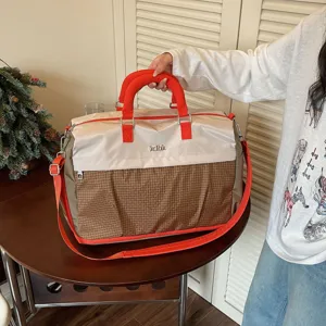 Large capacity travel duffel bag for women and men, lightweight gym and weekend bag.