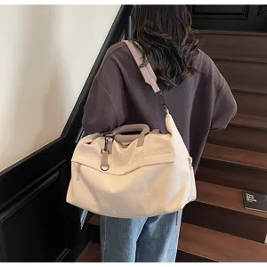Large capacity travel duffel bag for women, lightweight casual shoulder fitness bag detail.