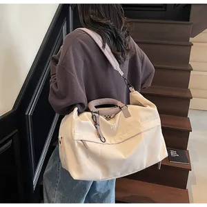 Detailed view of large capacity casual travel duffel bag with shoulder strap and stylish design.