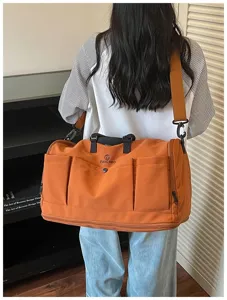 Large capacity travel duffel bag, multi-pocket overnight weekender bag for sports and gym.
