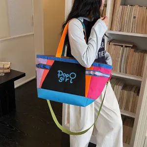 Spacious colorblock tote bag for women, casual canvas shoulder bag with top handles and strap.