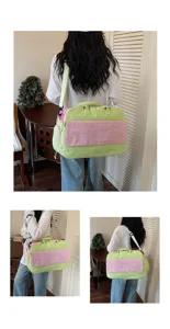 Detail shot of colorblock travel duffel bag, large capacity fashion gym bag for women.