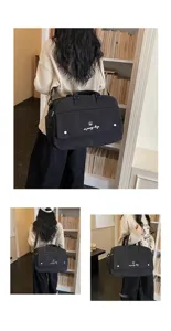 Black travel duffel bag large capacity casual gym sports bag with shoulder strap and handles.