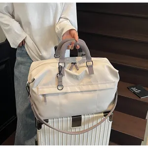 Fashionable large capacity travel duffel bag for women and men, lightweight and portable.