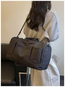 Large capacity travel duffel bag for women, stylish gym bag and waterproof weekend bag.