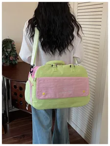 Stylish color block travel duffel bag for women, large capacity lightweight gym bag.