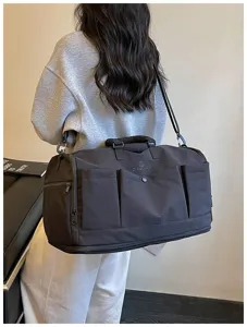 Large capacity travel duffel bag with multi pockets and shoulder strap for gym and weekend trips.