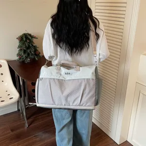 Large capacity travel duffel bag for women and men, lightweight gym and weekend overnight bag.