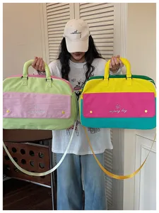 Colorblock travel duffel bag for women, large capacity lightweight gym and yoga storage bag.