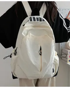 Casual waterproof lightweight school backpack for students, large capacity travel daypack.