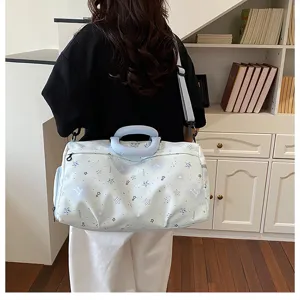Large capacity travel duffel bag for women, stylish lightweight shoulder luggage and gym bag.