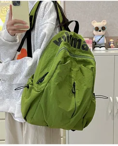 Detailed view of the lightweight waterproof green canvas backpack for daily outdoor travel.